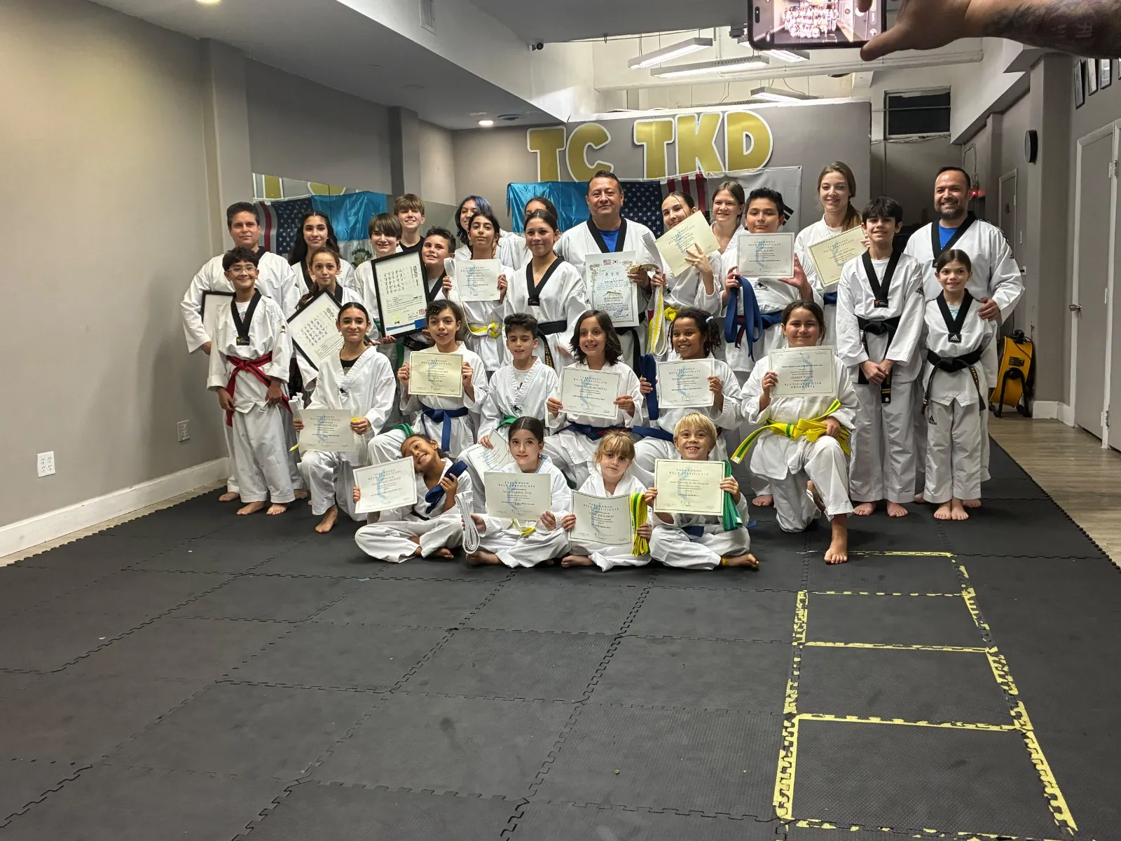 Belt certificate ceremony at the dojang